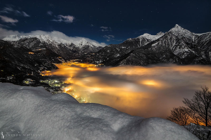 CHIAVENNA italy fog illuminated at night